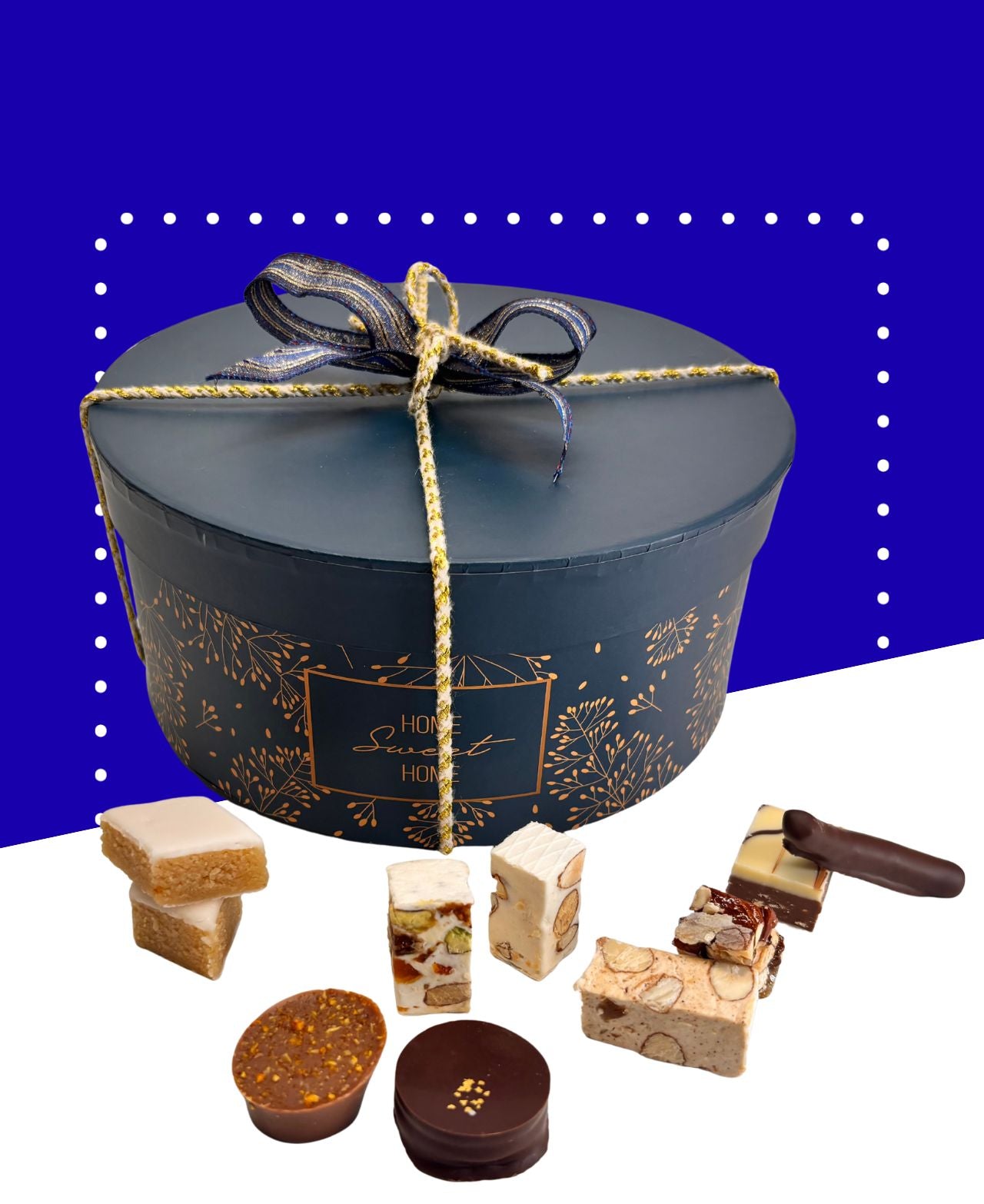 Boîte cadeau chapeau rouge avec nougats, calissons et chocolats assortis de 590g.
