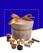 Coffret cadeau avec nougats, calissons, chocolats et pâtes de fruits pour Noël.