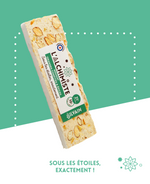 Nougat blanc L'alchimiste aux épices et morceaux d'oranges confites visible en gros plan