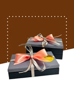 Assorted dark and milk chocolates in a decorative ballotin by SCHAAL.