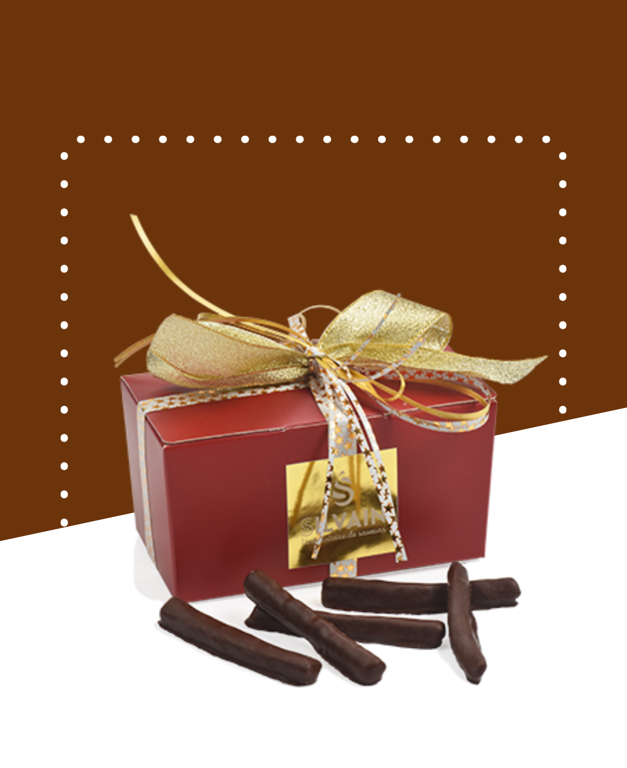 Boîte de ballotins Orangette de 100g avec des morceaux d'orange confite enrobés de chocolat.