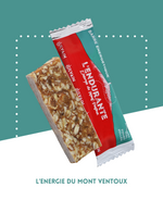Barre énergétique avec amandes, miel, figues, raisins et pollen, idéale pour les sportifs.