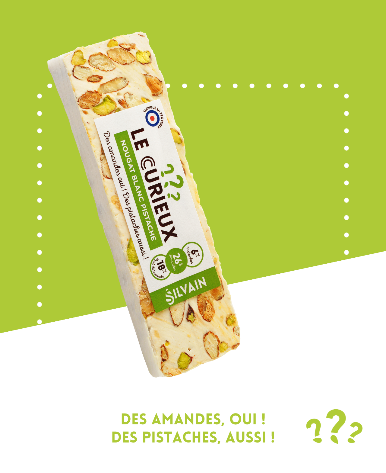 Nougat blanc avec pistaches et amandes, présenté dans un emballage élégant.