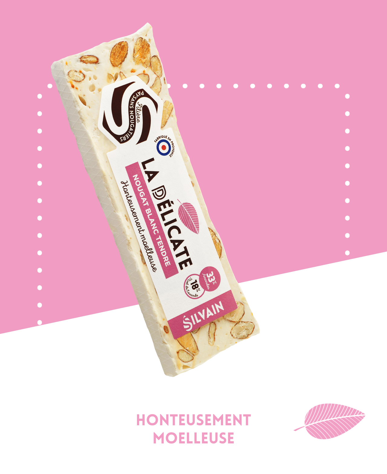 Tendre nougat blanc avec amande grillée et miel de lavande, présenté en morceaux.