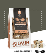Nougat blanc aux olives noires de Nyons, saupoudré de romarin finement moulu.