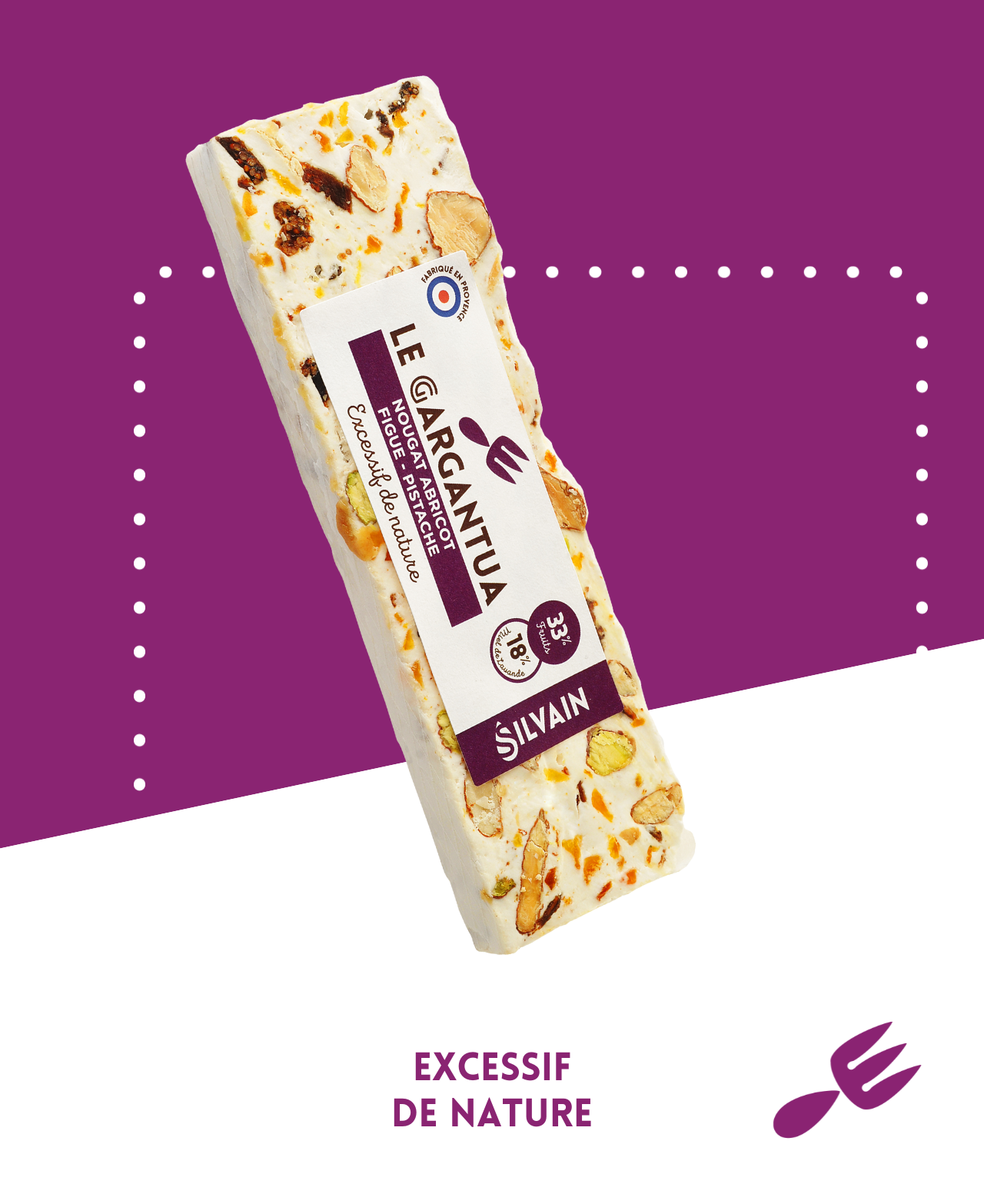 Nougat blanc avec abricots, figues, pistaches et amandes, présenté en morceaux.