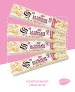 Tendre nougat blanc avec amandes grillées et miel de lavande, présenté en morceaux.