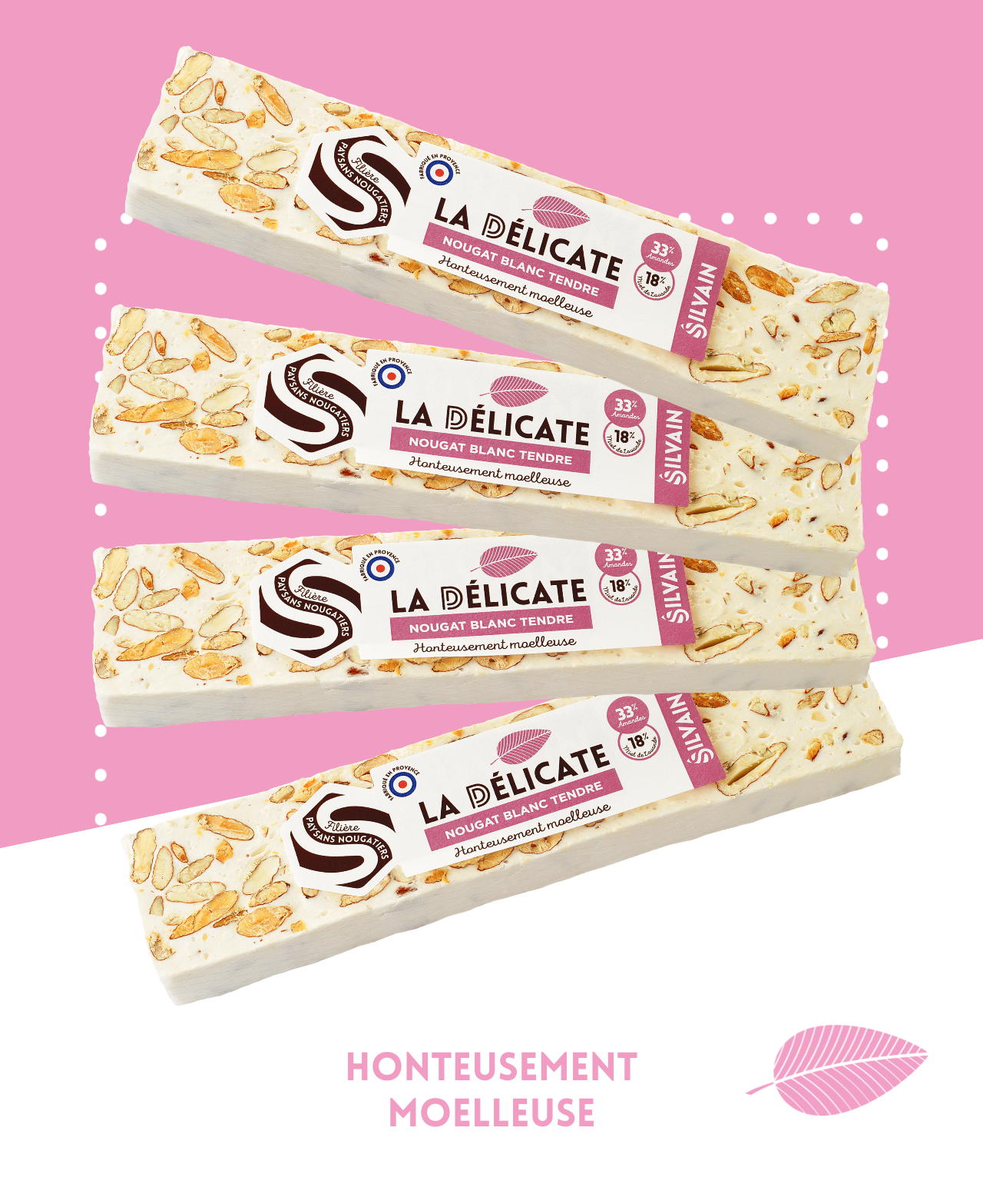 Tendre nougat blanc avec amandes grillées et miel de lavande, présenté en morceaux.