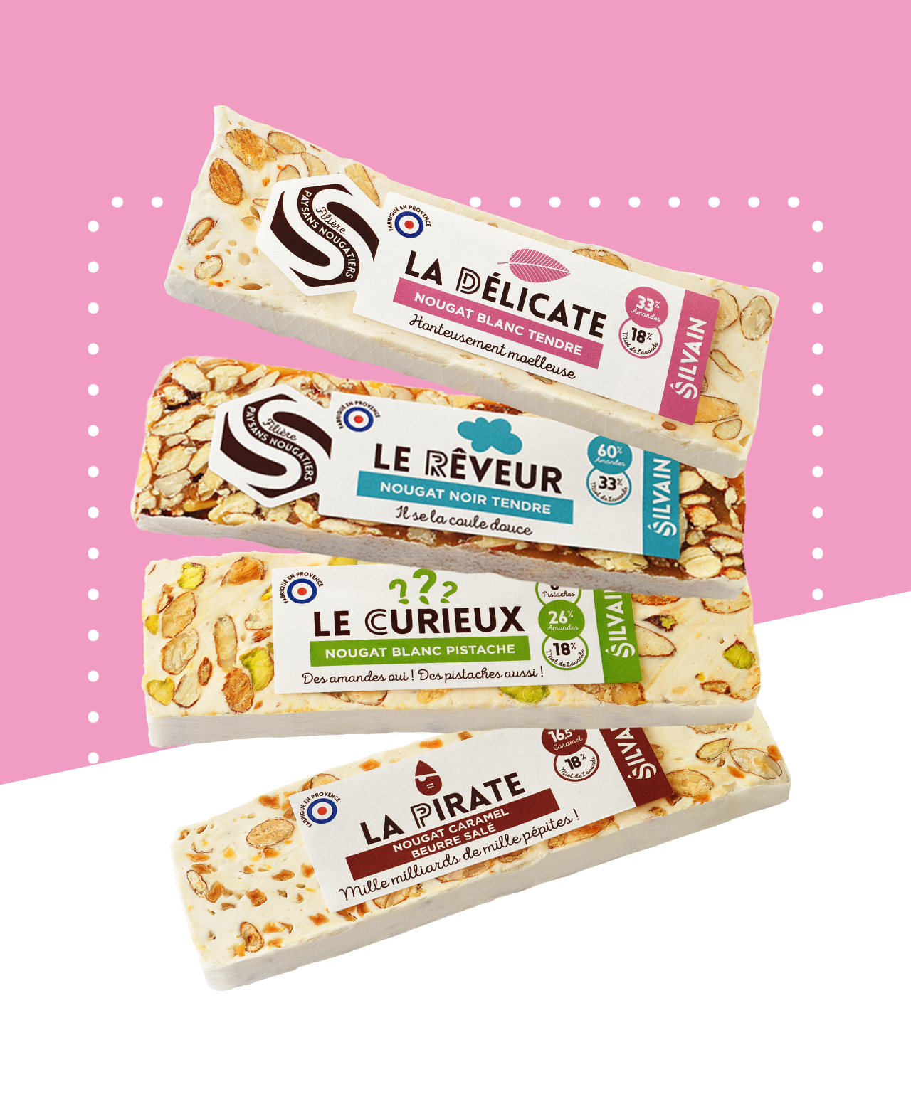 Assortiment de quatre barres de nougat avec différentes saveurs et textures.