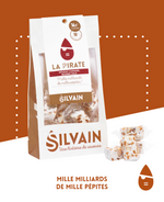 Tendre nougat blanc avec pépites de caramel au beurre salé dans un emballage coloré.